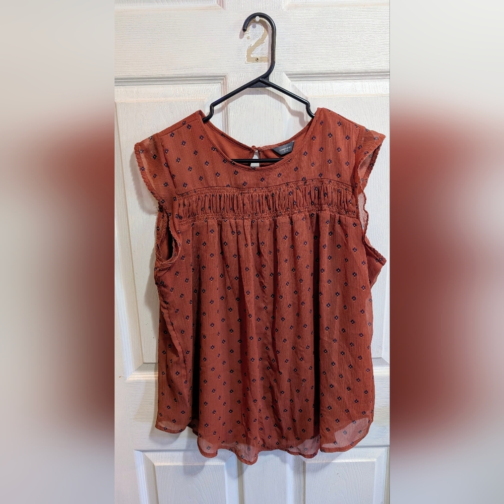 Rust Sleeveless Blouse with Floral Pattern